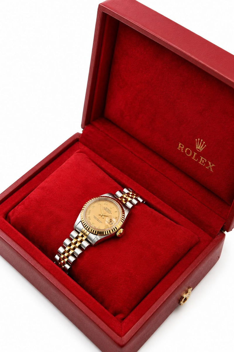 Rolex Lady-Datejust 26mm ref. 69173, champagne dial on two-tone Jubilee bracelet, shown at an angle in a red Rolex presentation box